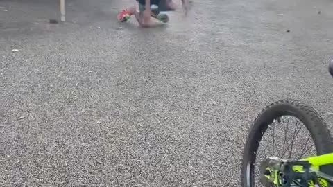 Energetic Boy Falls Climbing Up Slide