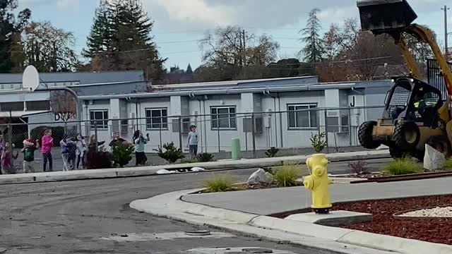 Construction Worker Shows Off for School Kids