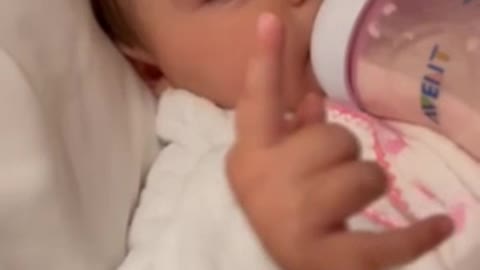 Adorable baby gets ready for bedtime