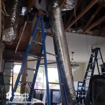 HVAC TECHNICIAN INSTALLING FLEXIBLE DUCTWORK IN A BIG REMODEL IN SCOTTSDALE ARIZONA