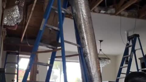 HVAC TECHNICIAN INSTALLING FLEXIBLE DUCTWORK IN A BIG REMODEL IN SCOTTSDALE ARIZONA