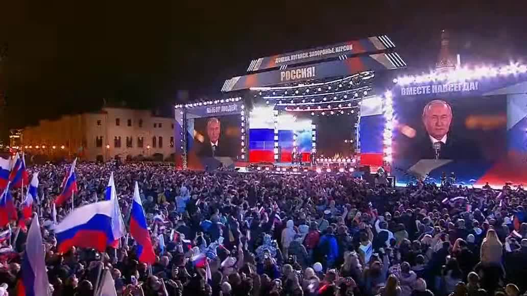 Crowd chants "Russia, Russia, Russia" in Moscow's Red Square as Putin makes an appearance.