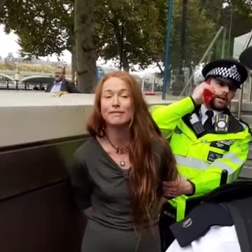 Climate protester vandalizing with paint