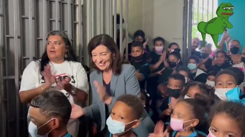 NEW - Maskless New York Gov. Kathy Hochul dances while surrounded by masked kids in Puerto Rico.