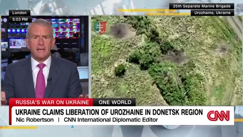 Soldiers raise Ukrainian flag