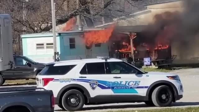 Car Pulls in Front of Flashing Fire Truck