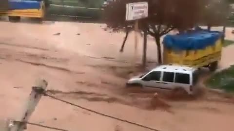 Dramatic video from Turkey shows men reportedly rescuing a mother and her child getting swept away..