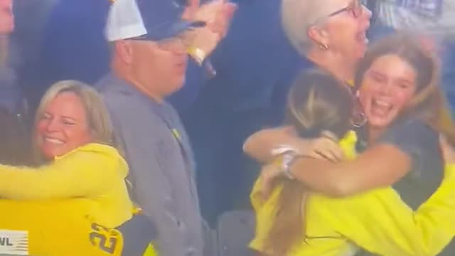 J.J. McCarthy’s dad sneaking a few feels on his son’s girlfriend