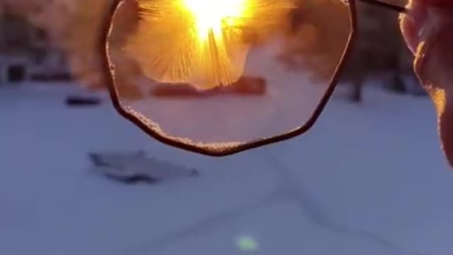 Frost Forms in DIY Bubble Wand as Person Dips It In Soap Water And Holds in Cold Weather