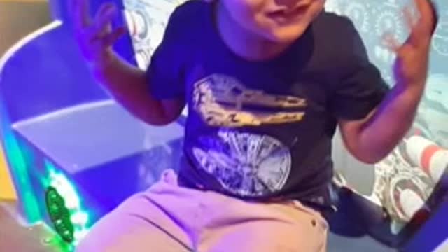 Little boy enjoing video