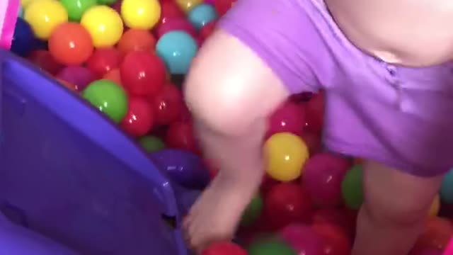 Having fun and making a mess in her playroom