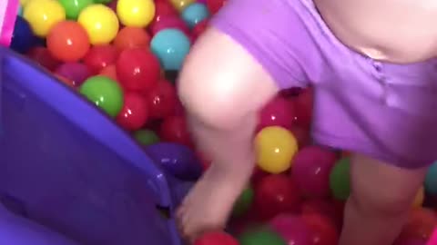 Having fun and making a mess in her playroom