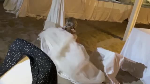 Bride's Acrobatics Attempt Fails at Wedding
