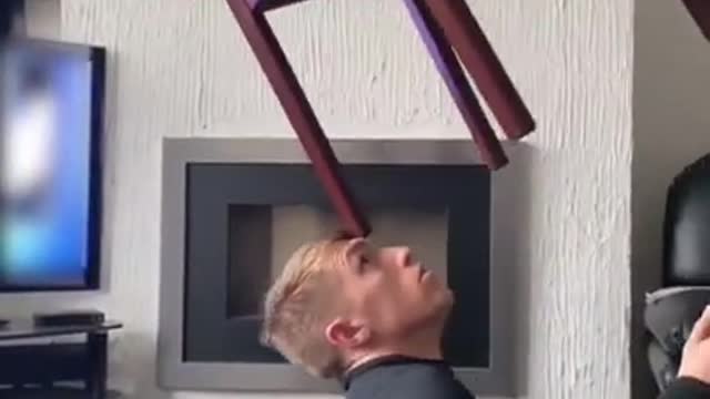 Guy Balances Random Heavy Objects on His Face