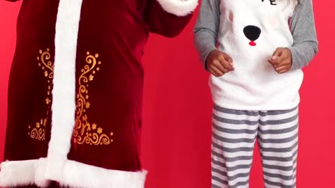 Young Girl and Santa Claus Dancing