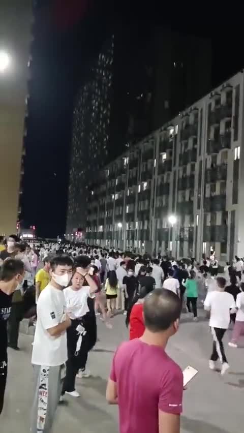 CHINA, Huizhou City - After work , tens of thousands of workers running for daily routine PCR test