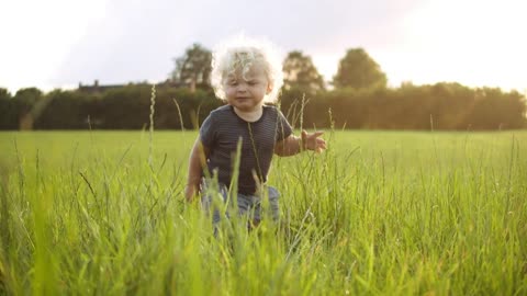 Child kid playing with grass