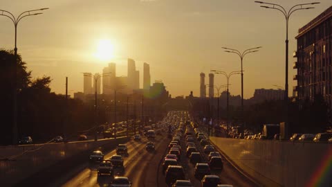 Cars are running on road.Beautiful view of sunset is looking gorgeous