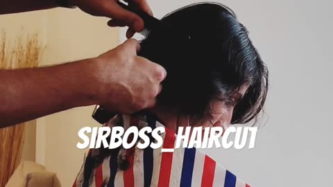 woman headshave in barbershop by barber