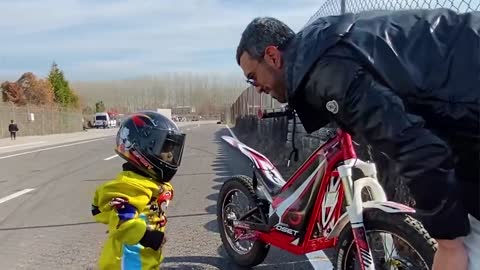 She is 2.5 years old and rides a motorcycle.