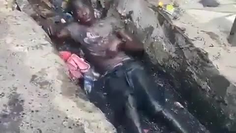 Man Thrashes Around On The Ground In Trash, Probably On Drugs