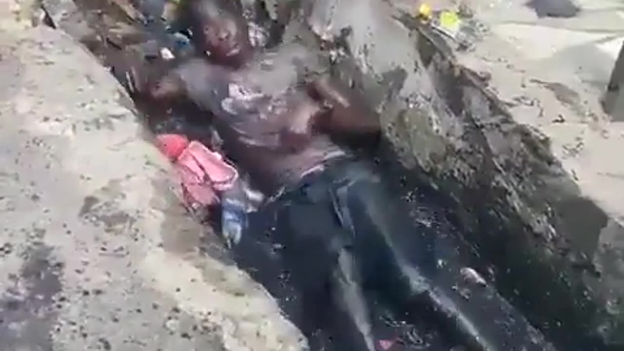 Man Thrashes Around On The Ground In Trash, Probably On Drugs