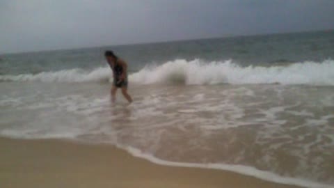 Funny screaming girl on the beach