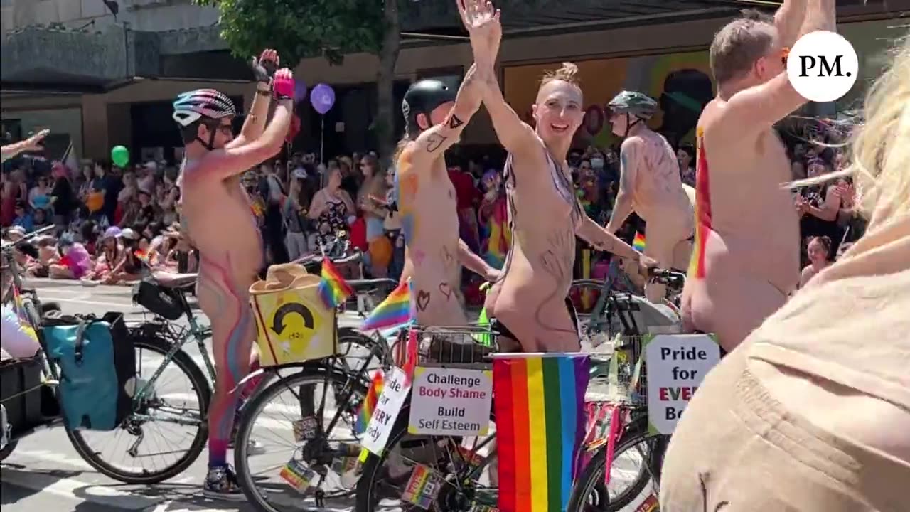 Fully-naked adults riding bikes expose their genitalia to children at Seattle Pride