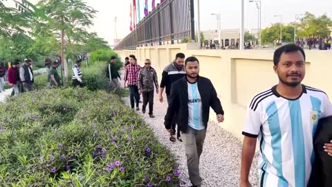 Migrant workers arrive to watch World Cup final