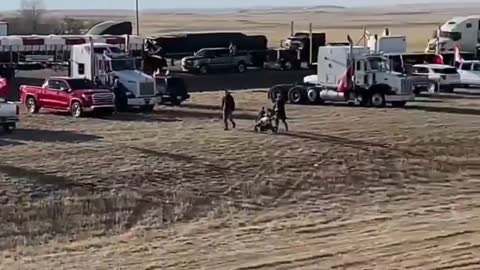 BREAKING: Massive convoy of truckers have blockaded the US-Canada border crossing in Alberta