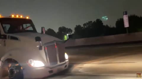 Guy in stolen big rig waves to camera