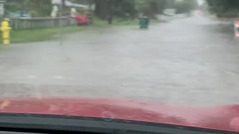 Couple Drives on Flooded Streets After Rainstorm Hits Area in Florida