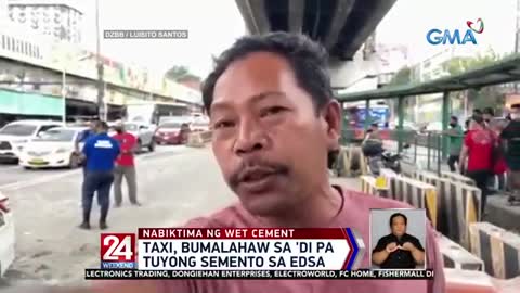 Taxi, bumalahaw sa 'di pa tuyong semento sa EDSA