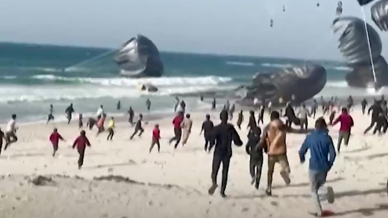 Palestinians in Gaza rush to receive airdropped
