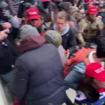 New video of Trump supporters attempting to stop people from breaking windows at the Capitol