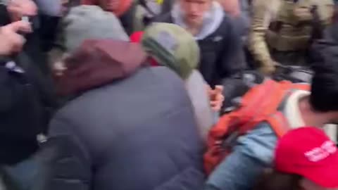 New video of Trump supporters attempting to stop people from breaking windows at the Capitol