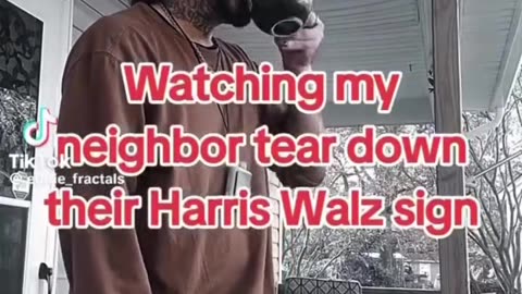 Watching neighbor tear down her Harris Walz sign