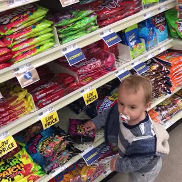 Baby has a sweet tooth while food shopping