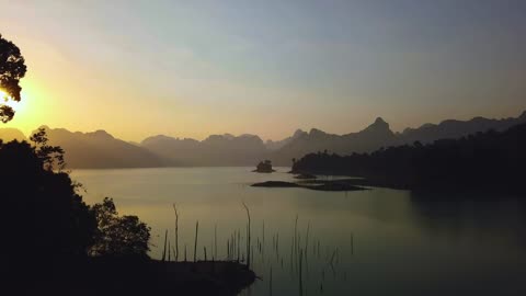 mixkit-landscape-of-a-large-lake-during-sunset-from-the-air