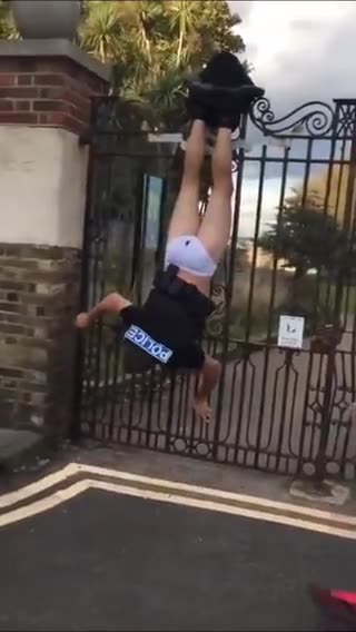 Police Officer gets stuck on a fence and shits his pants while chasing a suspect.