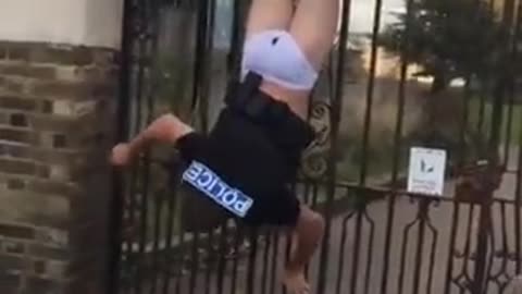 Police Officer gets stuck on a fence and shits his pants while chasing a suspect.