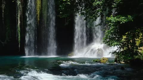 Cascading Waterfall In The Mountains