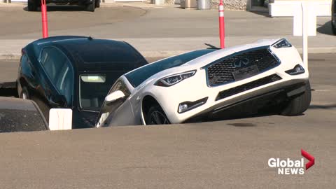 Sinkhole swallows several cars at Edmonton dealership