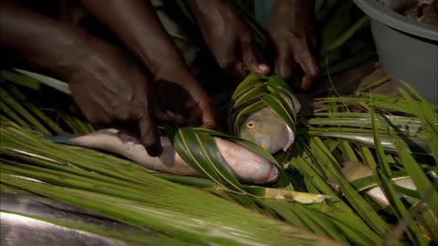 Tribal catching fish