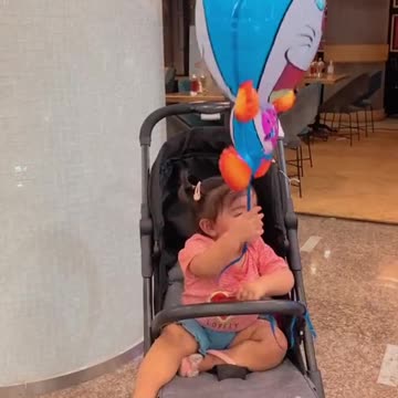 Funny baby playing with doraemon