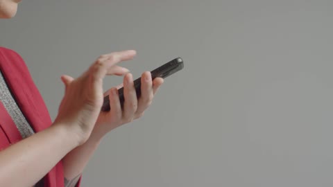 Side view of female caucasian model using smartphone 01