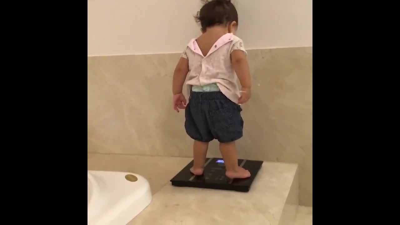 Baby Shocked by Weight on Scale