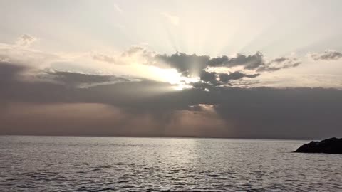 Waves Kissing the Shore Under a Golden Sky