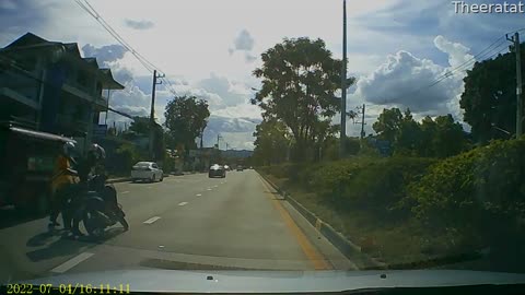 Motorcyclist Knocked Over by Truck