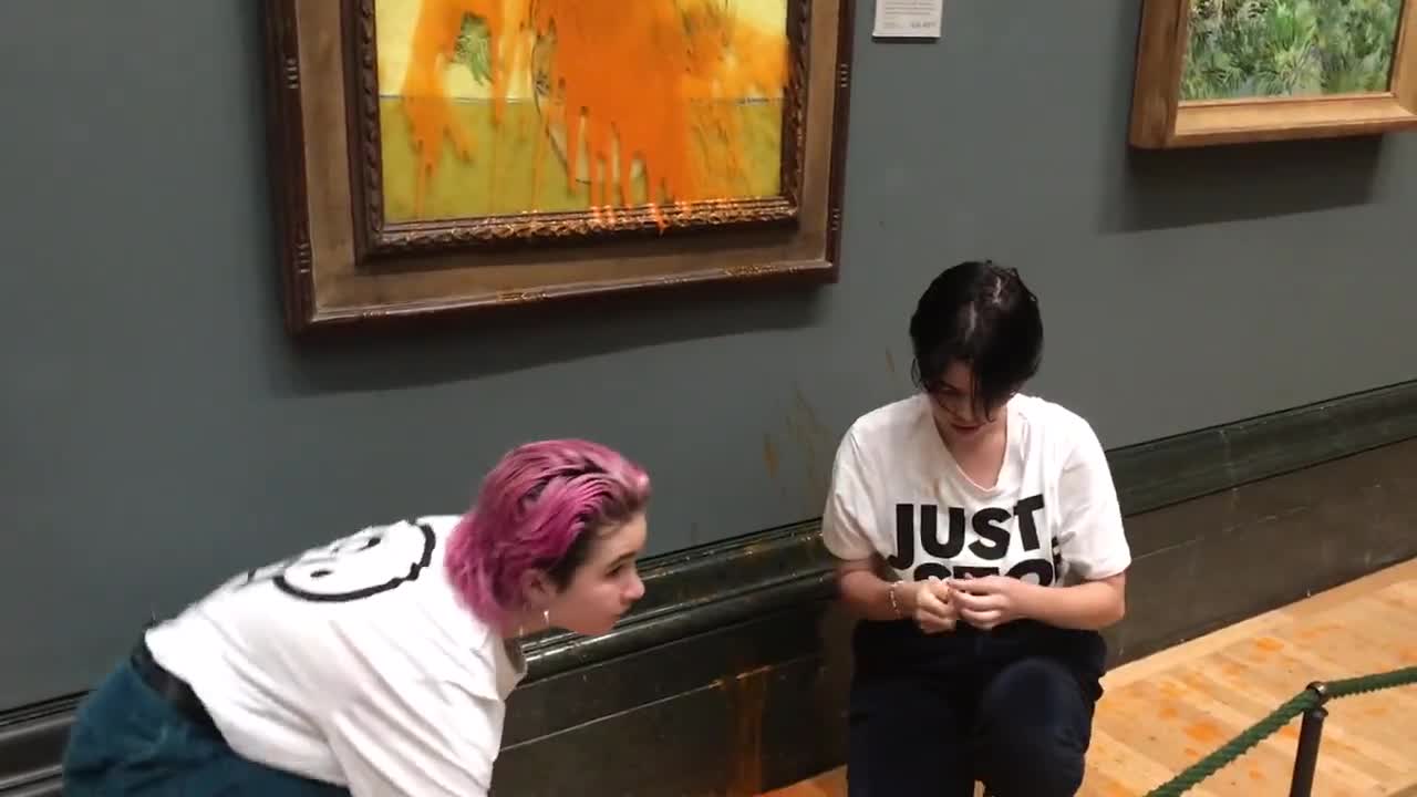 Two Climate Activists Defile Van Gogh's Masterpiece Then Glue Themselves to the Wall